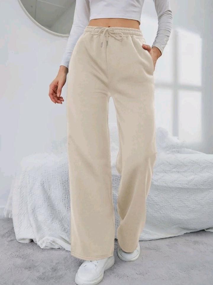 Women's High-Waist Wide-Leg Jogging Pants with elastic comfort waistband, drawstring, and deep side pockets Mune Fashion