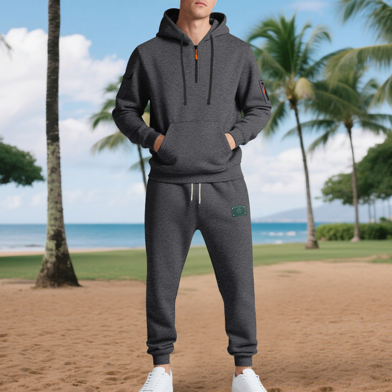 Men's half-zip hoodie and tapered jogger set with kangaroo pocket, zipper details, and elastic drawstring waistband Mune Fashion