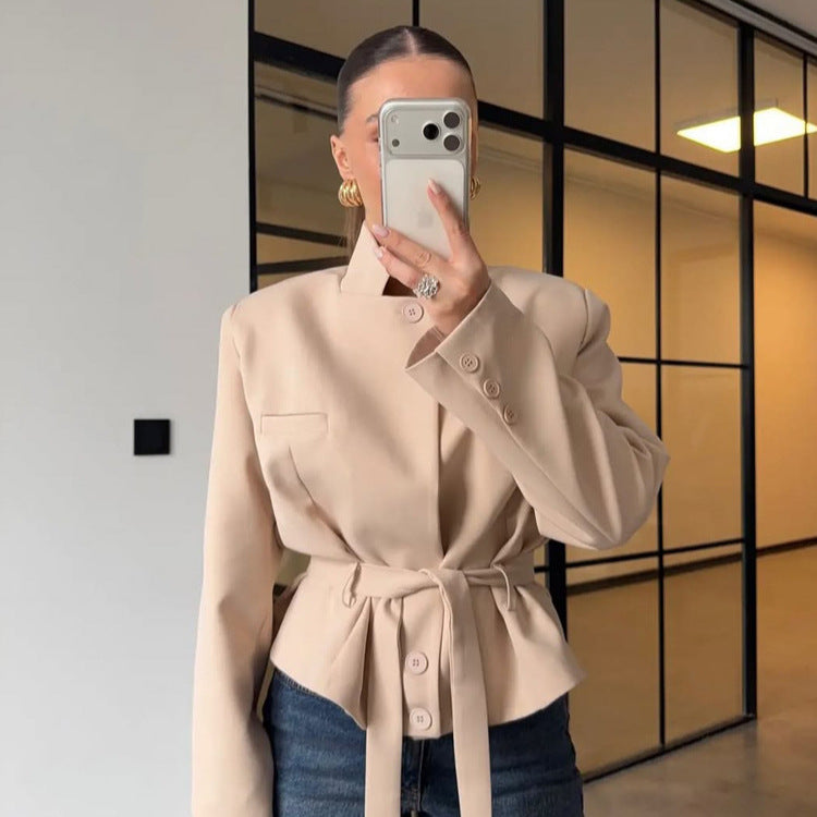 Women's tailored short blazer with standing collar, peplum, and tie belt Mune Fashion