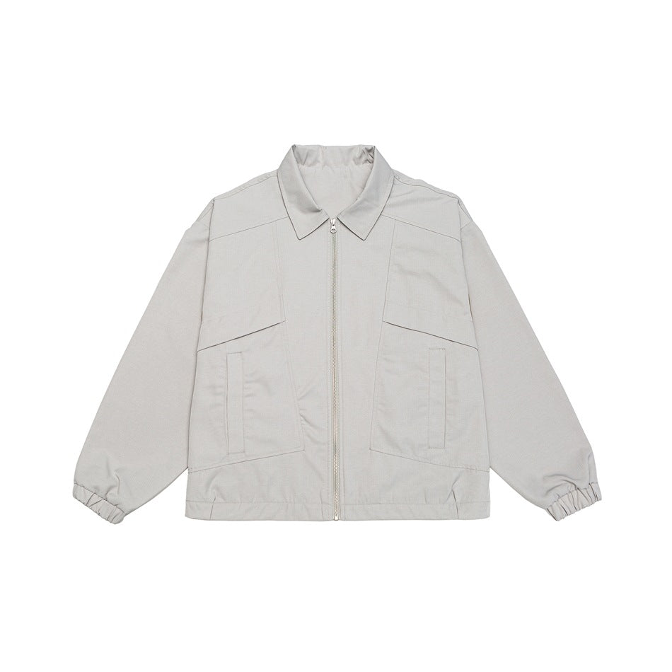 Unisex short jacket in boxy cut with continuous zipper and flap pockets Mune Fashion