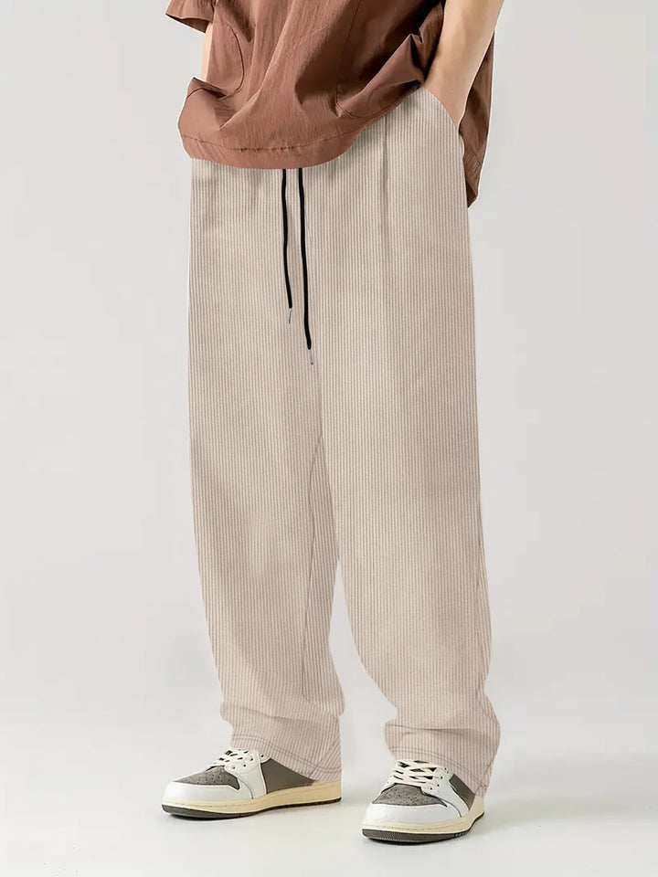Men's loose Relax leisure pants made of ribbed jersey with drawstring, side pockets, and wide leg Mune Fashion
