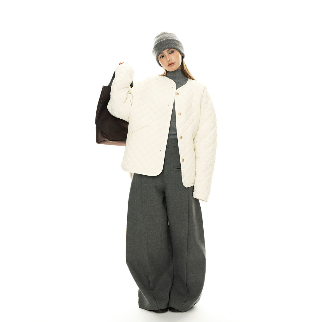 Women’s light padded oversized quilted jacket with round neckline and patch pockets Mune Fashion