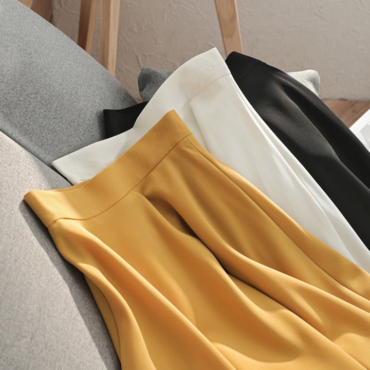 Women Flowing High-Waisted Midi Skirt with Wavy Hem & Light Volume