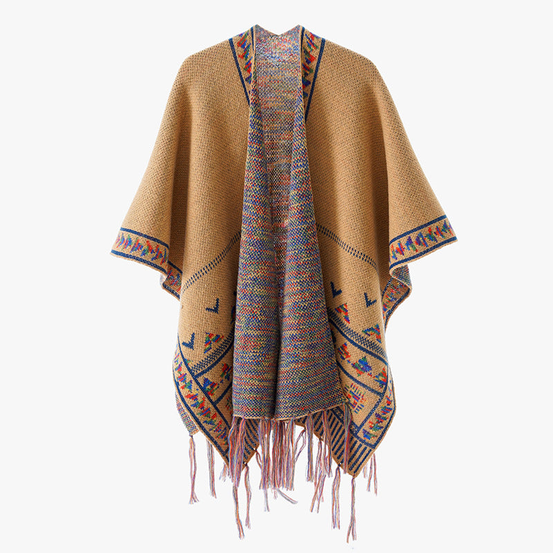Women's chunky knit poncho with woven ethnic trim and fringes Mune Fashion