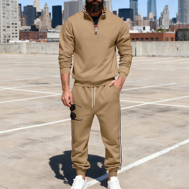 Men's stylish tracksuit set with half-zip, striped side stripes, and tapered jogger pants Mune Fashion