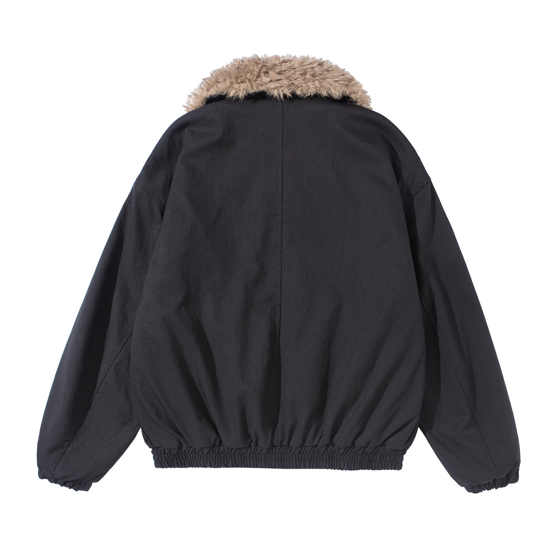 Women's short jacket with voluminous faux fur collar, kangaroo pockets, and elastic hem Mune Fashion
