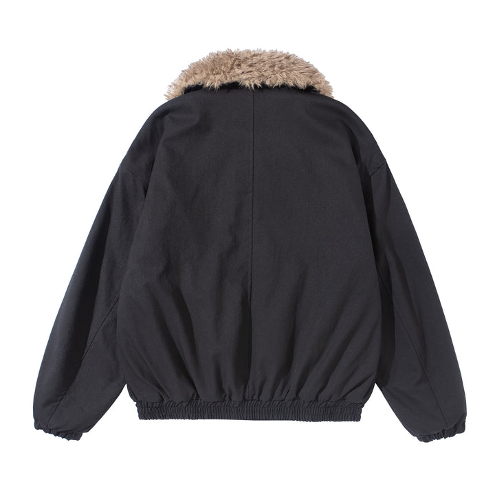 Women's short jacket with voluminous faux fur collar, kangaroo pockets, and elastic hem Mune Fashion
