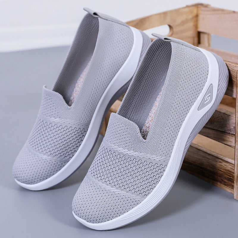 Ladies' knitted slip-on comfort sneakers with sock-like fit, breathable knitted upper, and shock-absorbing EVA midsole Mune Fashion