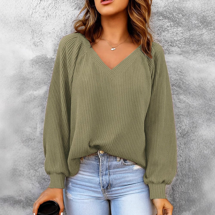 Women's fine structure knit sweater with V-neck, balloon sleeves, and ribbed cuffs Mune Fashion