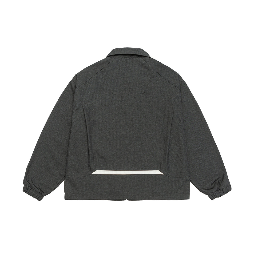 Unisex short jacket in boxy cut with shirt collar, visible metal zipper and utility patch pockets Mune Fashion