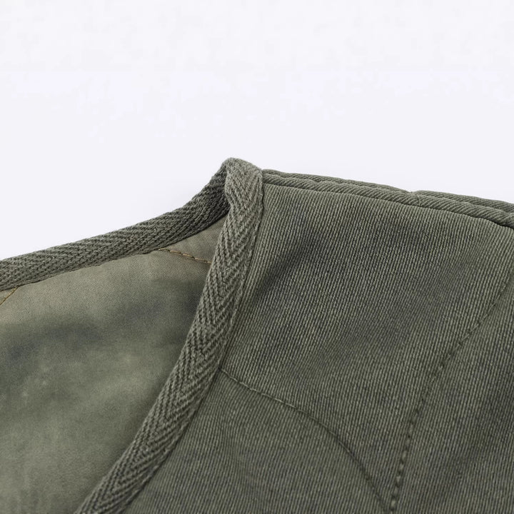Women's short quilted jacket with round neck, two-way zipper and button placket Mune Fashion