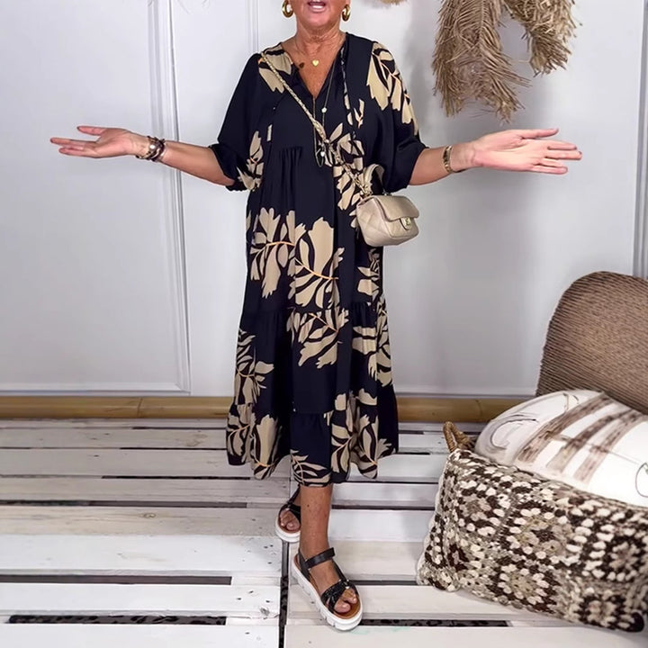 Women’s casual tiered midi dress with V-neck and large floral print Mune Fashion