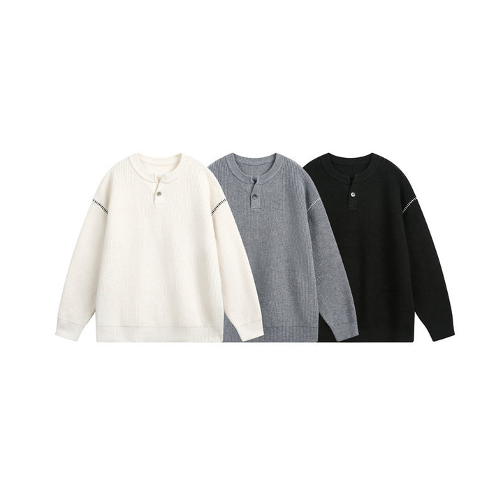 Unisex chunky knit henley pullover with button placket and drop shoulder drape