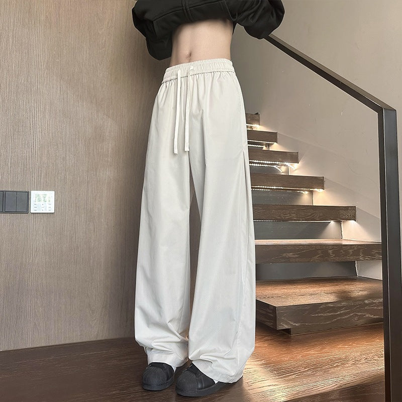 Women's wide-cut lounge pants with high elastic waistband and drawstring Mune Fashion