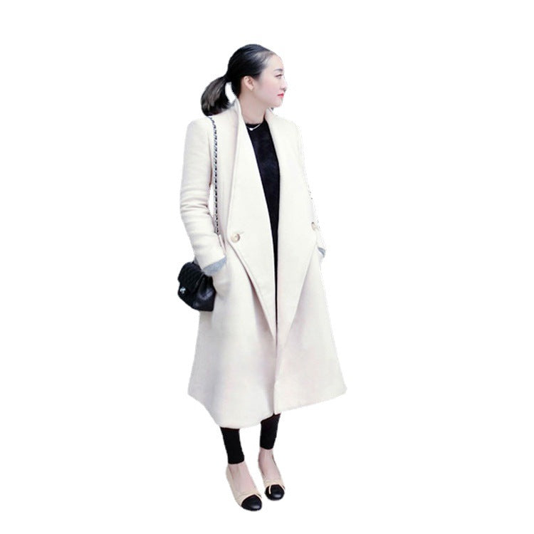 Women's midi-length tailored wool blend long coat with shawl collar, inset pockets, and discreet decorative buttons Mune Fashion