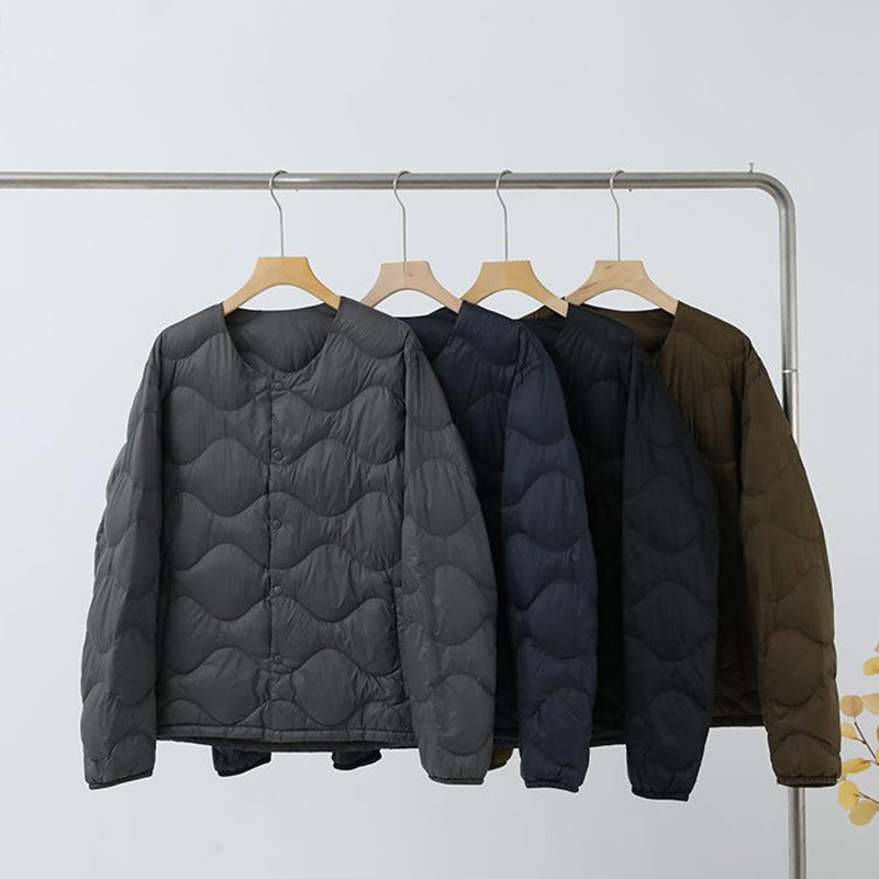 Women’s sleeveless thermal quilted vest with wave-shaped quilting and snap button closure Mune Fashion