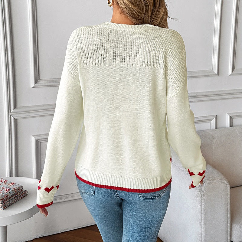 Ladies fine knit sweater with heart jacquard, lace structure, and ribbed hem