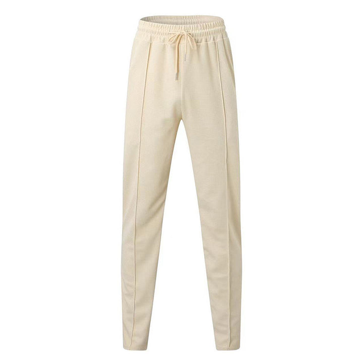 Men's patterned jogging pants with elastic drawstring, shaping crease, and tapered leg Mune Fashion