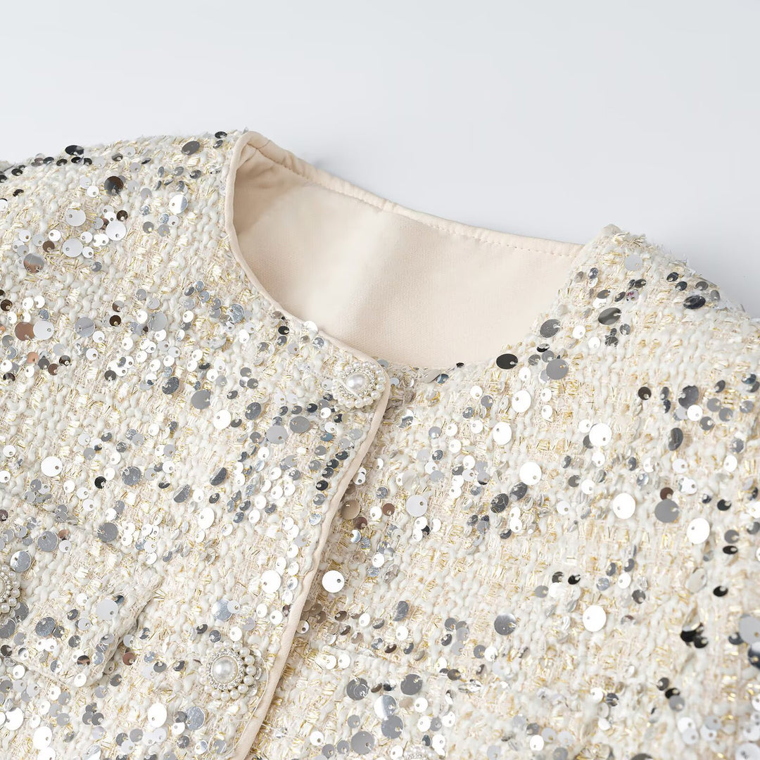 Women's short jacket made of bouclé with sequin trim, decorative pearl buttons, and a belted waist Mune Fashion