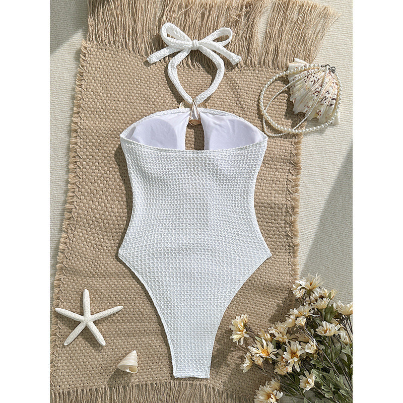 Women's one-piece swimsuit with sophisticated cut-out design and golden accents Mune Fashion