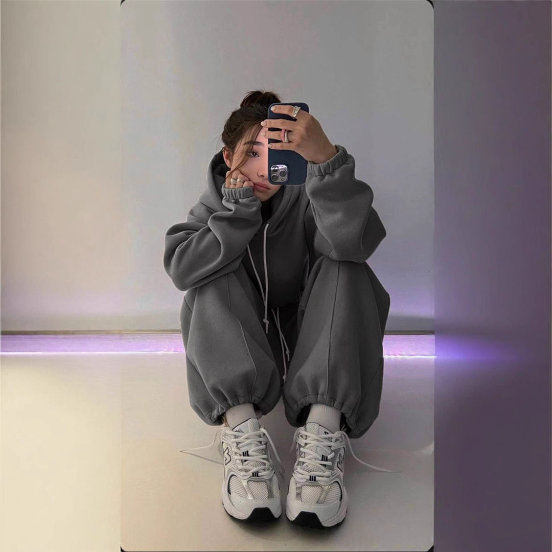 Women's oversized hoodie and jogger set with soft inner lining, adjustable drawstring, and raised waistband.