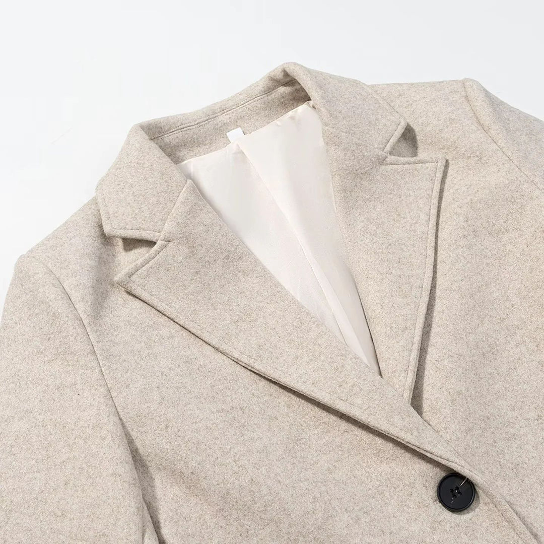Women's knee-length single-breasted wool blend coat with lapel collar and welt pockets Mune Fashion