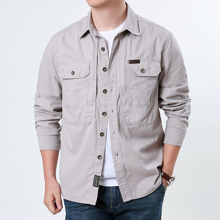 Men's casual utility shirt jacket made of cotton twill with two patch breast pockets and buttonable front.