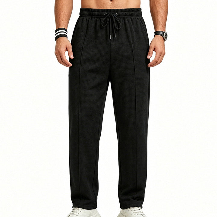 Men's straight-cut relaxed trousers with decorative center seam, elasticated drawstring waistband and side pockets Mune Fashion