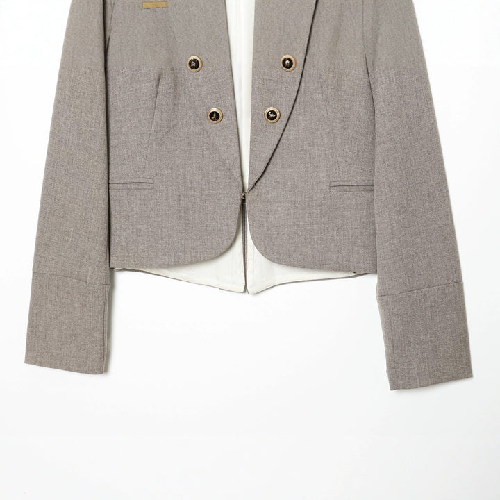 Women's short fitted blazer jacket with stand-up collar, concealed zip and decorative buttons Mune Fashion