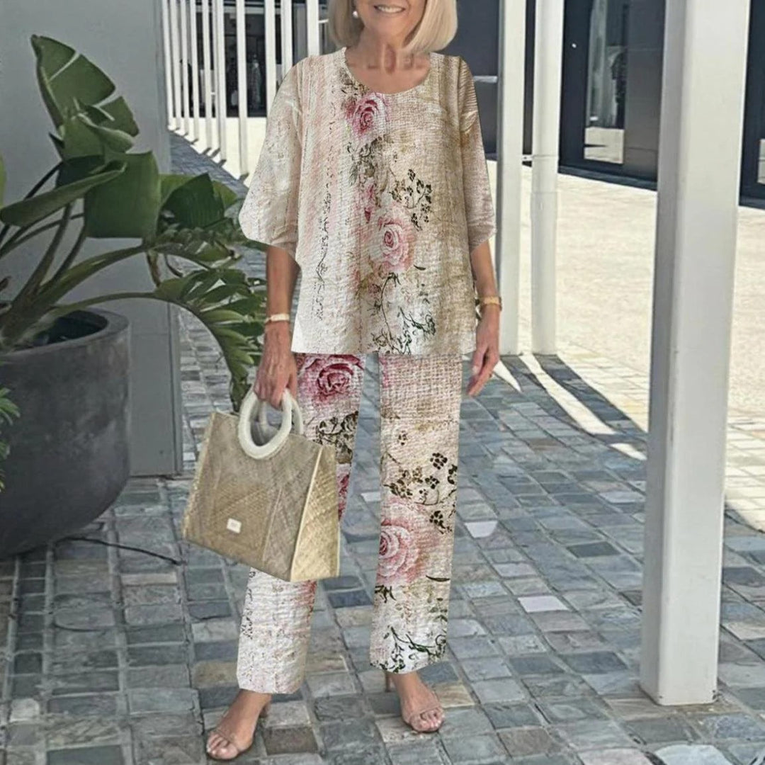 Women's layered tunic with cape sleeves and ankle-length straight leg pants with graphic print Mune Fashion