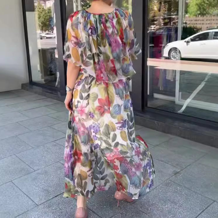 Women’s airy chiffon maxi dress with floral print, gathered round neckline and elastic waistband Mune Fashion