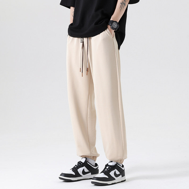 Men's Wide Jogging Pants in a Loose Fit with Adjustable Drawstring, Elastic Ankle Cuffs, and Soft Touch Mune Fashion