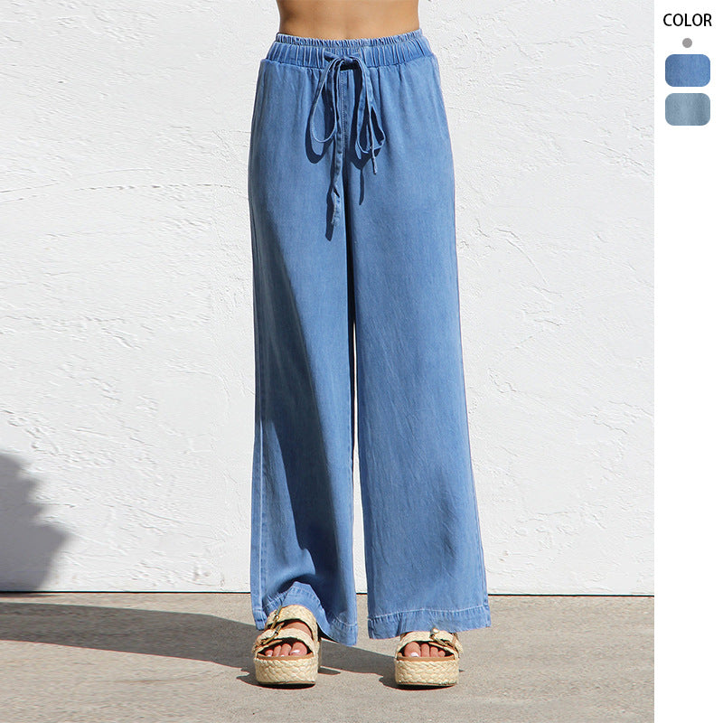 Ladies' wide linen-look summer trousers with elastic waistband, drawstring, and side pockets Mune Fashion