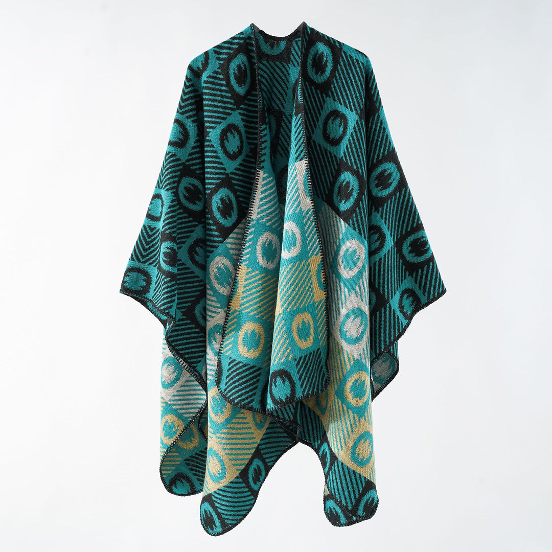 Women's jacquard wrap poncho made of fine knit with graphic circle jacquard and open kimono silhouette.