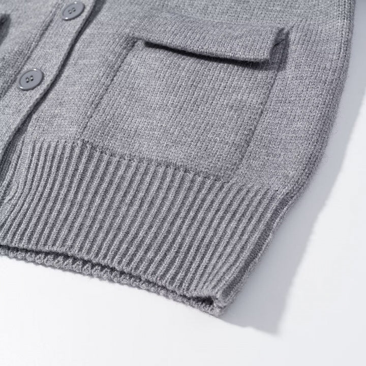 Women's knitted cardigan with large shawl collar, button placket, and patch pockets Mune Fashion