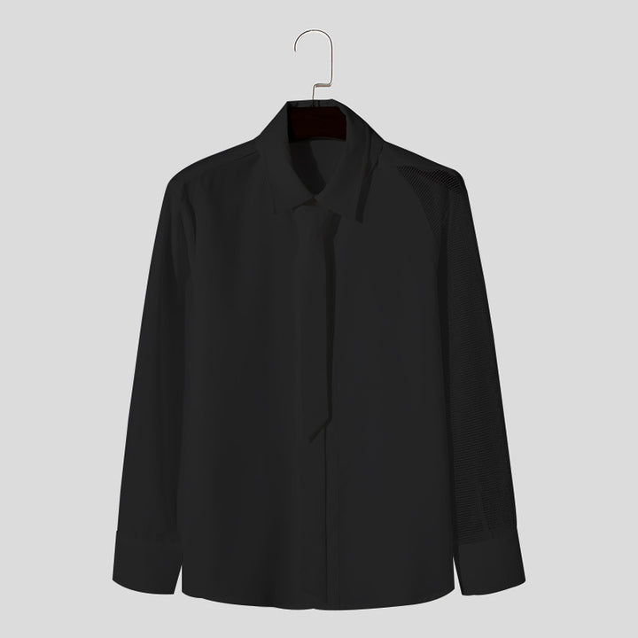 Women’s flowing blouse with attached bow, concealed button placket, and one-sided mesh sleeve detail Mune Fashion