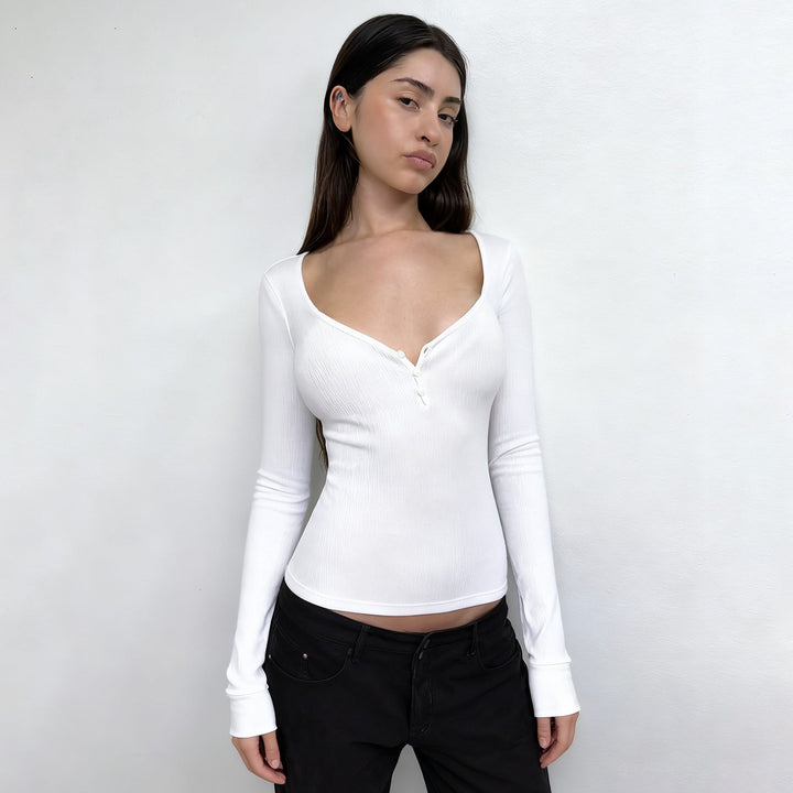 Women's form-fitting ribbed long sleeve Henley top with deep V-neck and button placket Mune Fashion