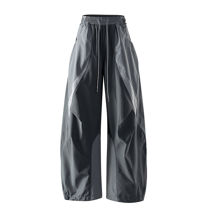 Women's wide technical balloon pants with drawstring waistband and insert panels