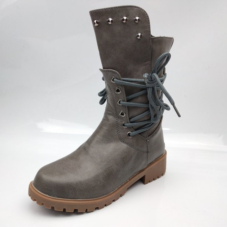 Women's rugged worker boots with decorative wrap lacing, metal eyelets, and profiled rubber outsole Mune Fashion