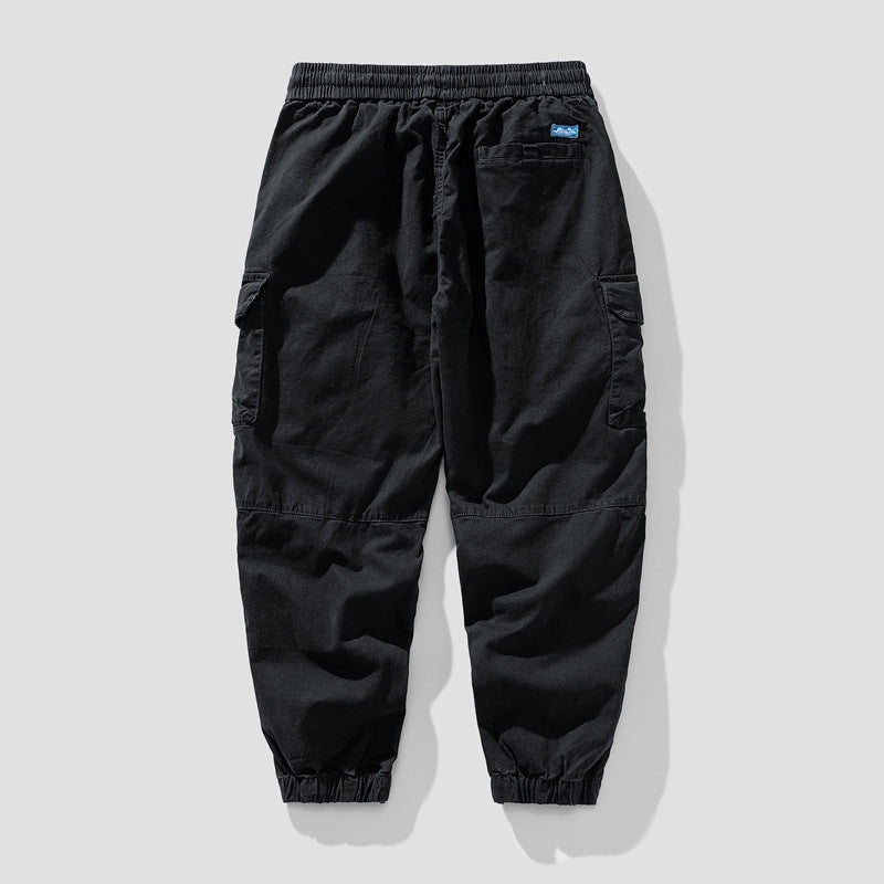 Herren Leichte Canvas-Cargohose im Joggerstil mit elastischem Bund, segmentierten Kniepaneelen und verdeckten Klappentaschen Mune Fashion