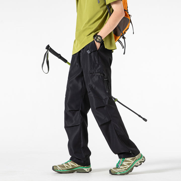 Men's Oversized Cargo Pants with Drawstring Waist, Multifunctional Flap and Leg Pockets, and Adjustable Cord Endings Mune Fashion