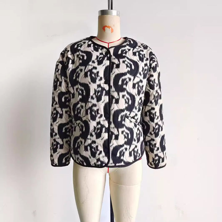 Ladies' quilted short jacket with abstract textured print, lightweight thermal padding, and contrasting piping Mune Fashion