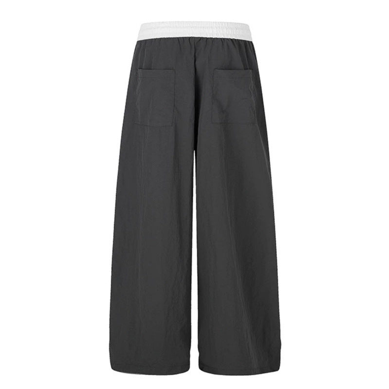 Women's wide loungewear pants with high comfort waistband, drawstring, adjustable hem, and typographic print Mune Fashion