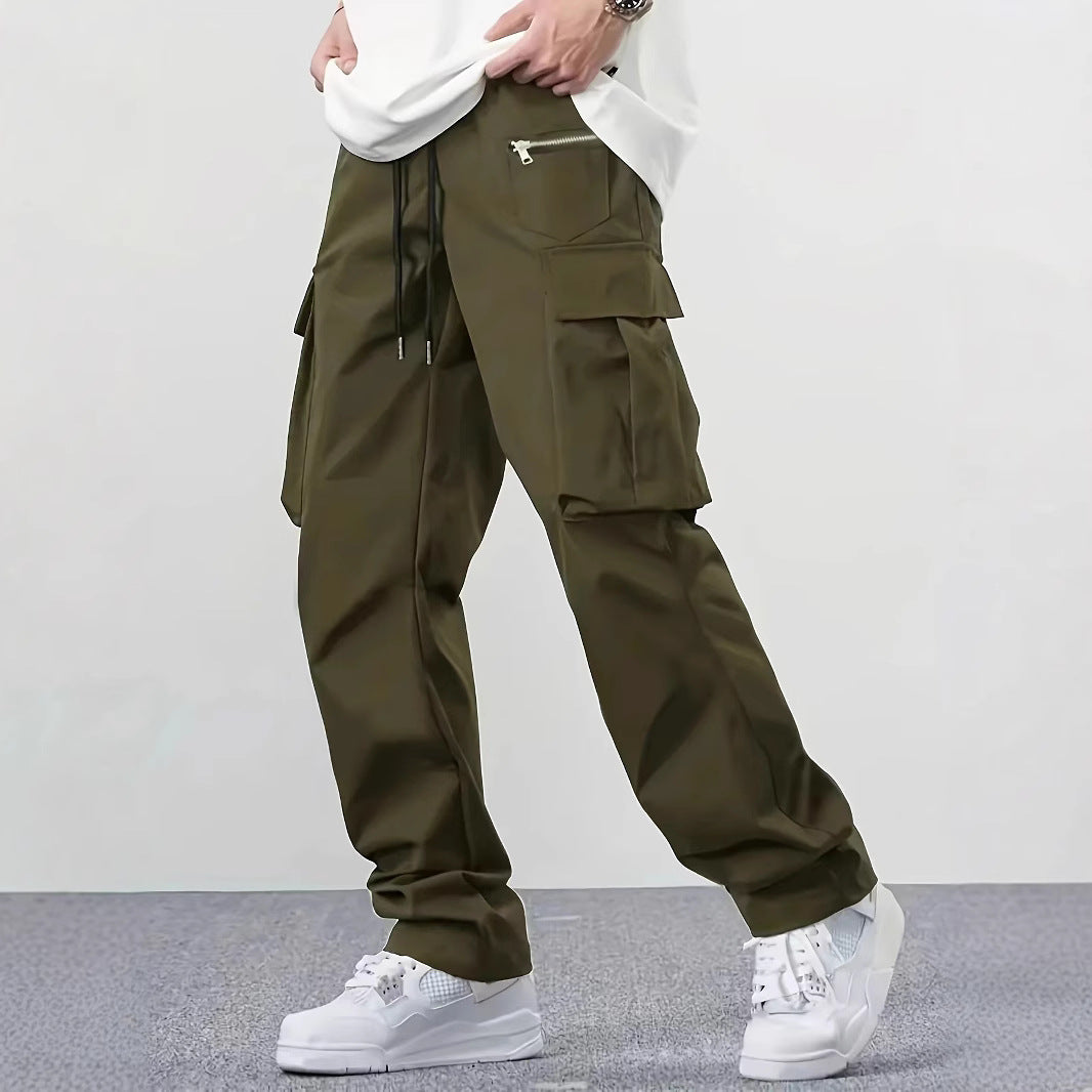 Men's wide technical cargo pants with large flap and zip pockets and drawstring waistband Mune Fashion