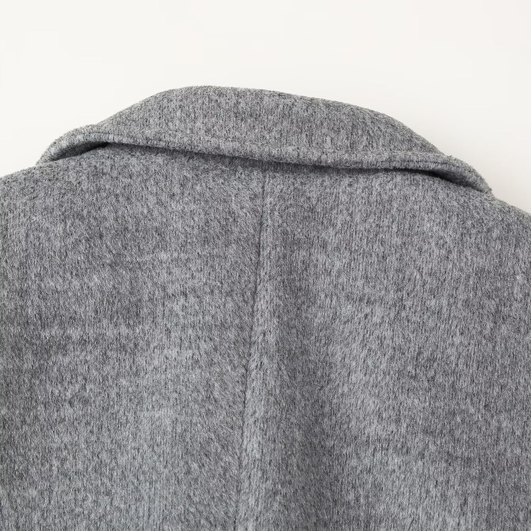 Women's short blazer coat made of wool blend with lapel collar, two-button closure, and patch pockets Mune Fashion