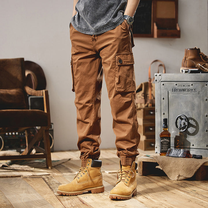 Men's robustly constructed cargo pants in jogger style with drawstring waistband, flap pockets, and elastic ankle cuffs Mune Fashion
