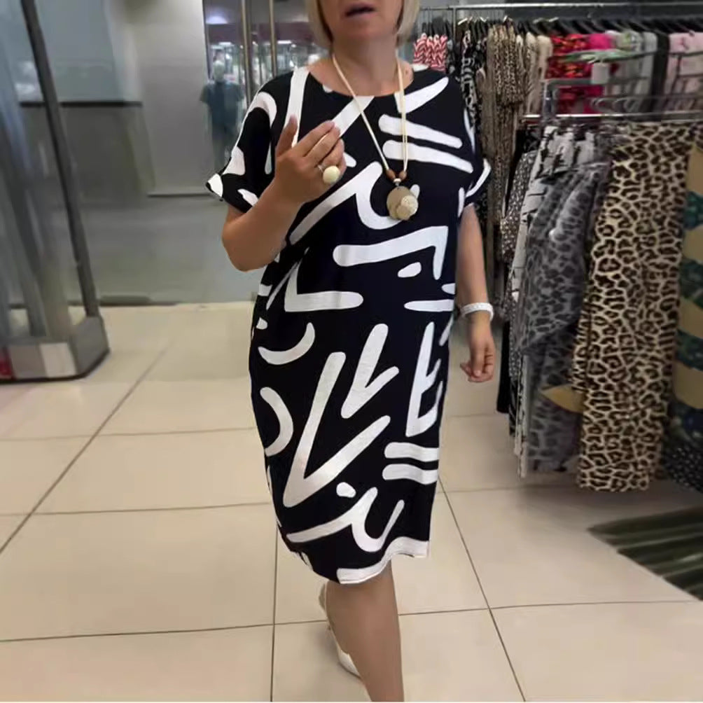 Women knee-length comfort shift dress with large brush stroke print and rolled short sleeves Mune Fashion