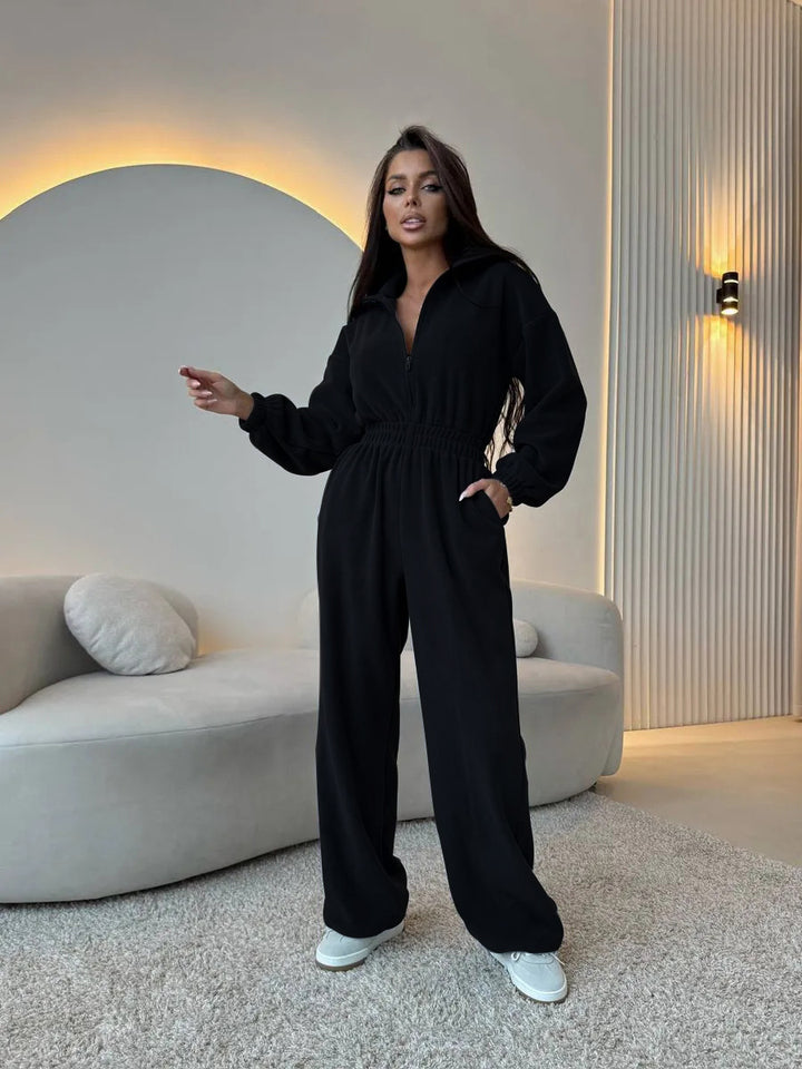 Women's elegant lounge overall with elastic waistband, stand collar, zipper and wide leg.