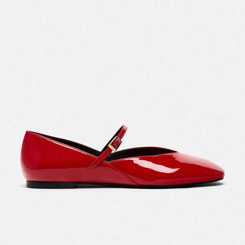 Women's elegant patent leather Mary Jane ballerina flats with a fine metal buckle and pointed toe cap.