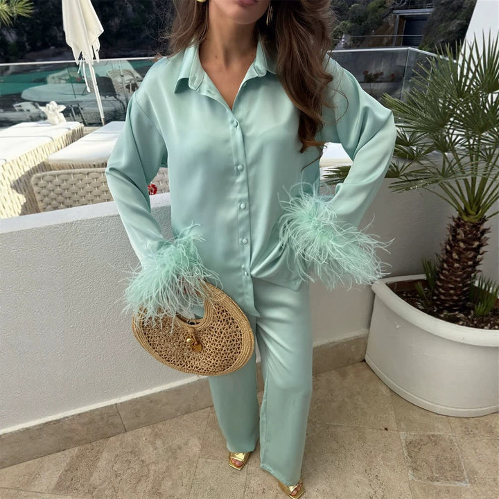 Ladies two-piece satin set with feather trim at the cuffs Mune Fashion
